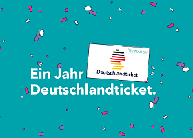 1 Jahr Deutschlandticket Schriftzug auf Konfetti