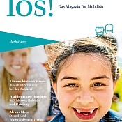 los! Titelblatt mit lachendem Kind