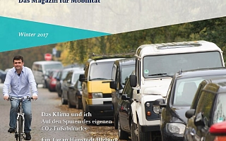 Los! Magazin Cover mit parkenden Autos rechts und einem Fahrradfahrer links