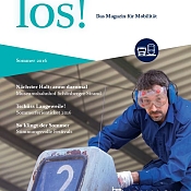 los! Titelblatt mit Mann in Arbeitskleidung